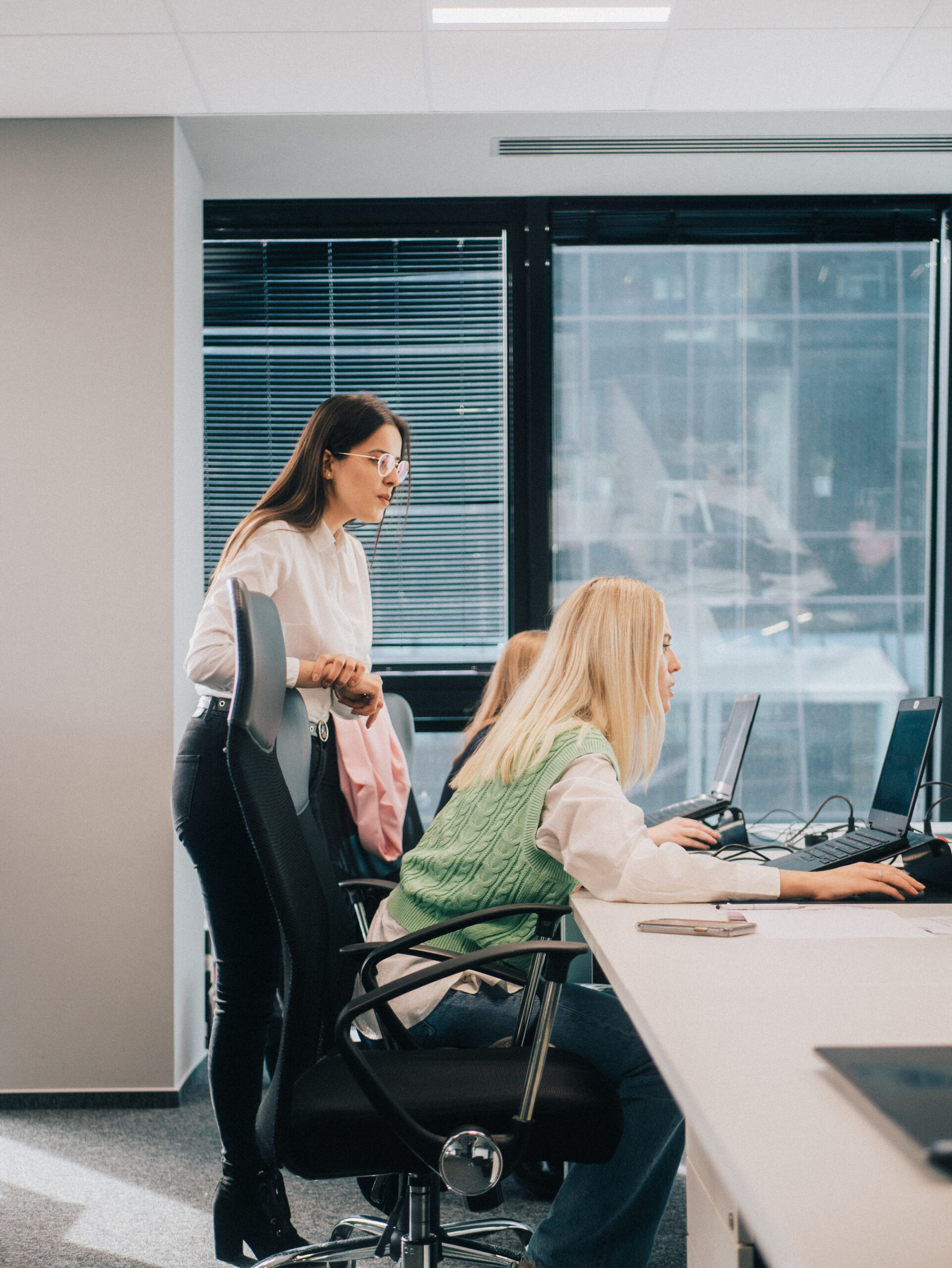 Colleagues working in a bright open office